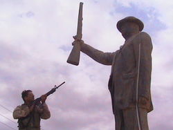 At the Al Quds power plant, North Baghdad, in front of an untoppled statue of Saddam Hussein. April 15, 2003